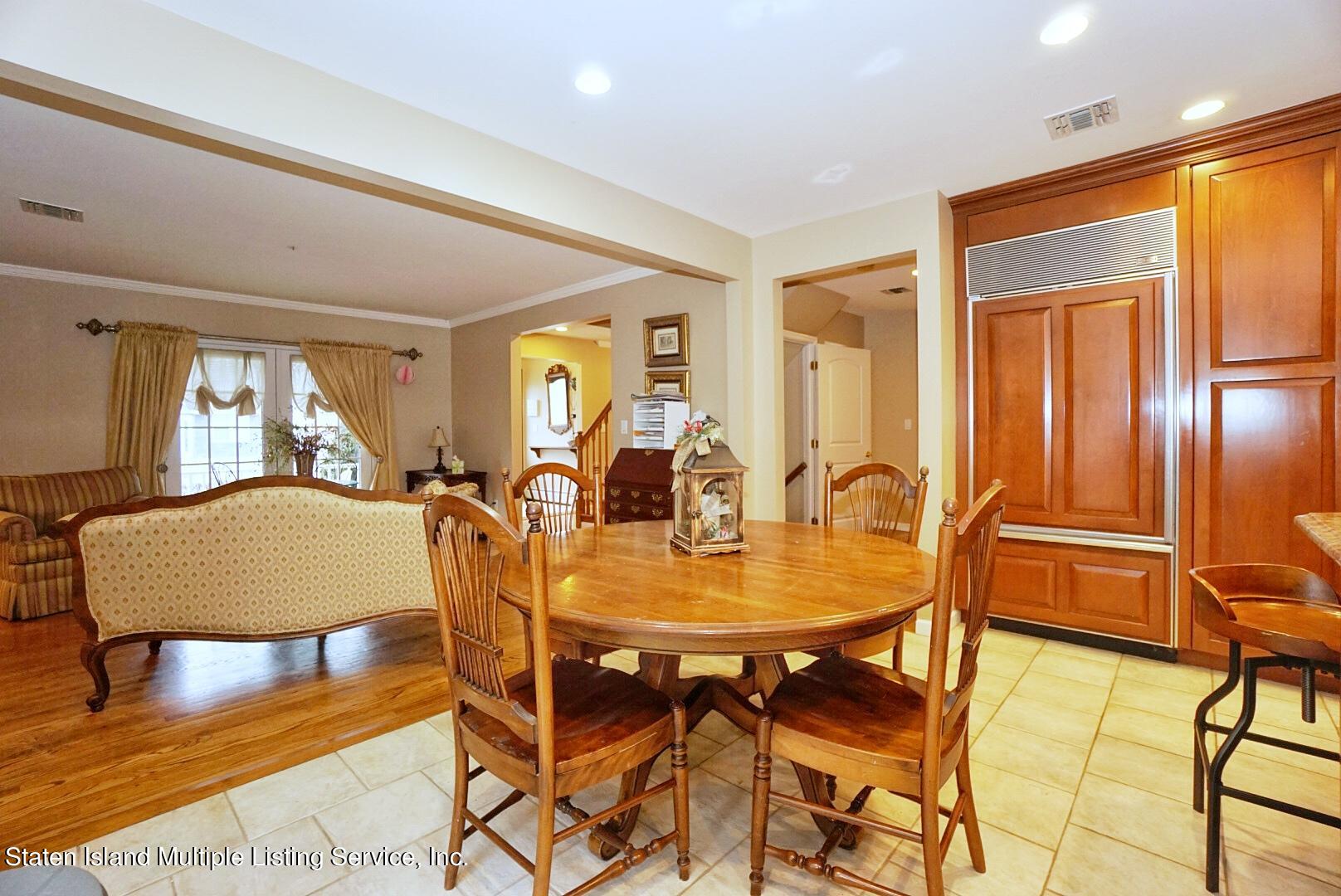 65 Lander Avenue Staten Island, NY 10314 - Photo 17 of 53 a dining room with furniture and window