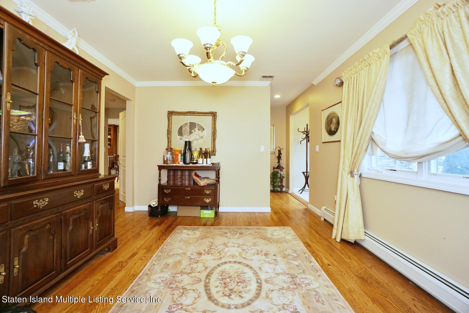 65 Lander Avenue Staten Island, NY 10314 - Photo 27 of 53 a spacious bathroom with a granite countertop sink a mirror and a shower