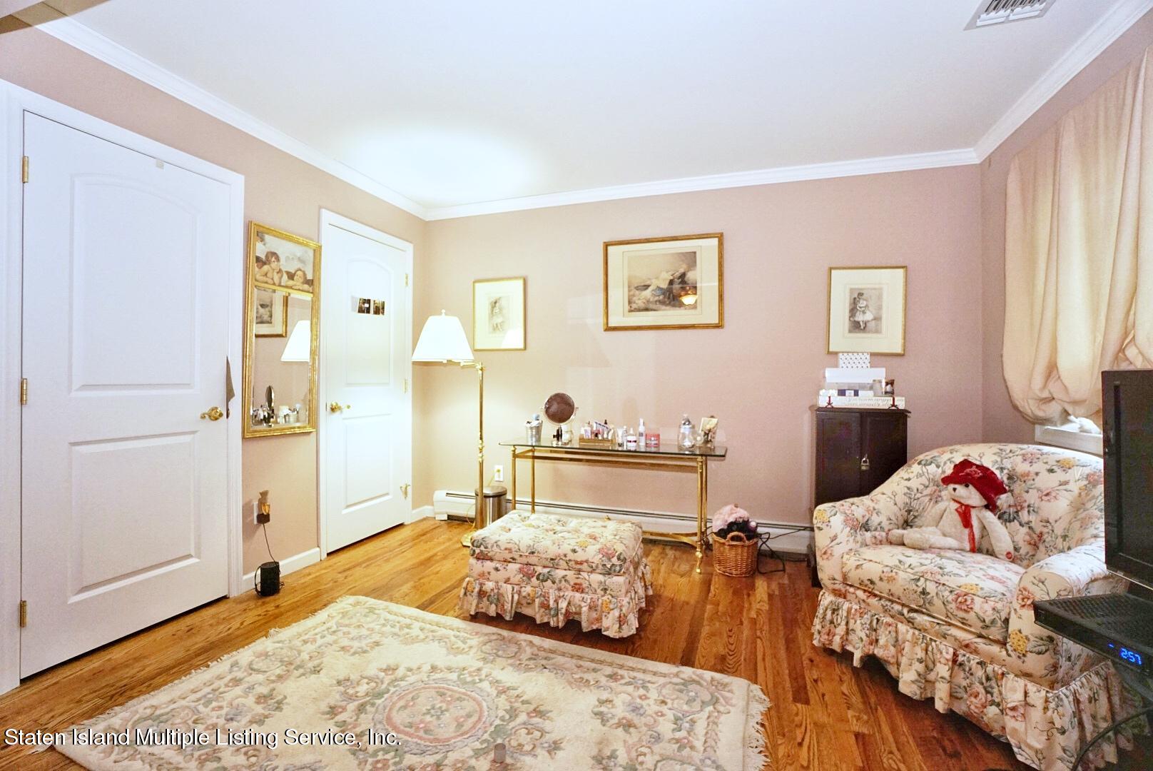 65 Lander Avenue Staten Island, NY 10314 - Photo 31 of 53 a bedroom with two bed and a window