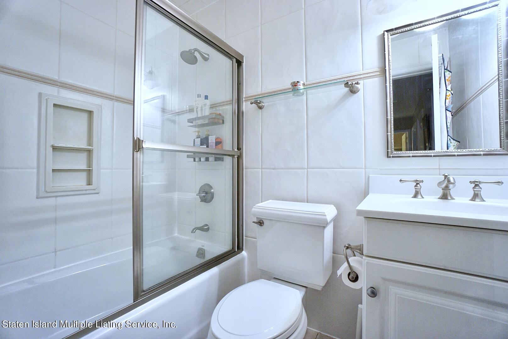 65 Lander Avenue Staten Island, NY 10314 - Photo 38 of 53 a bathroom with a toilet sink and shower