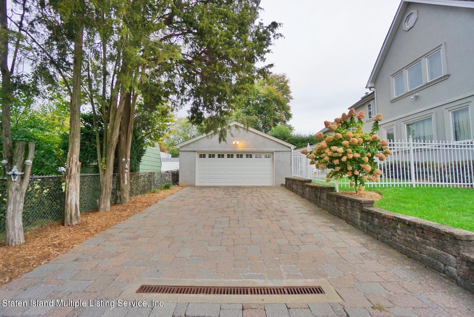 65 Lander Avenue Staten Island, NY 10314 - Photo 7 of 53 a view of a house with a yard and large tree