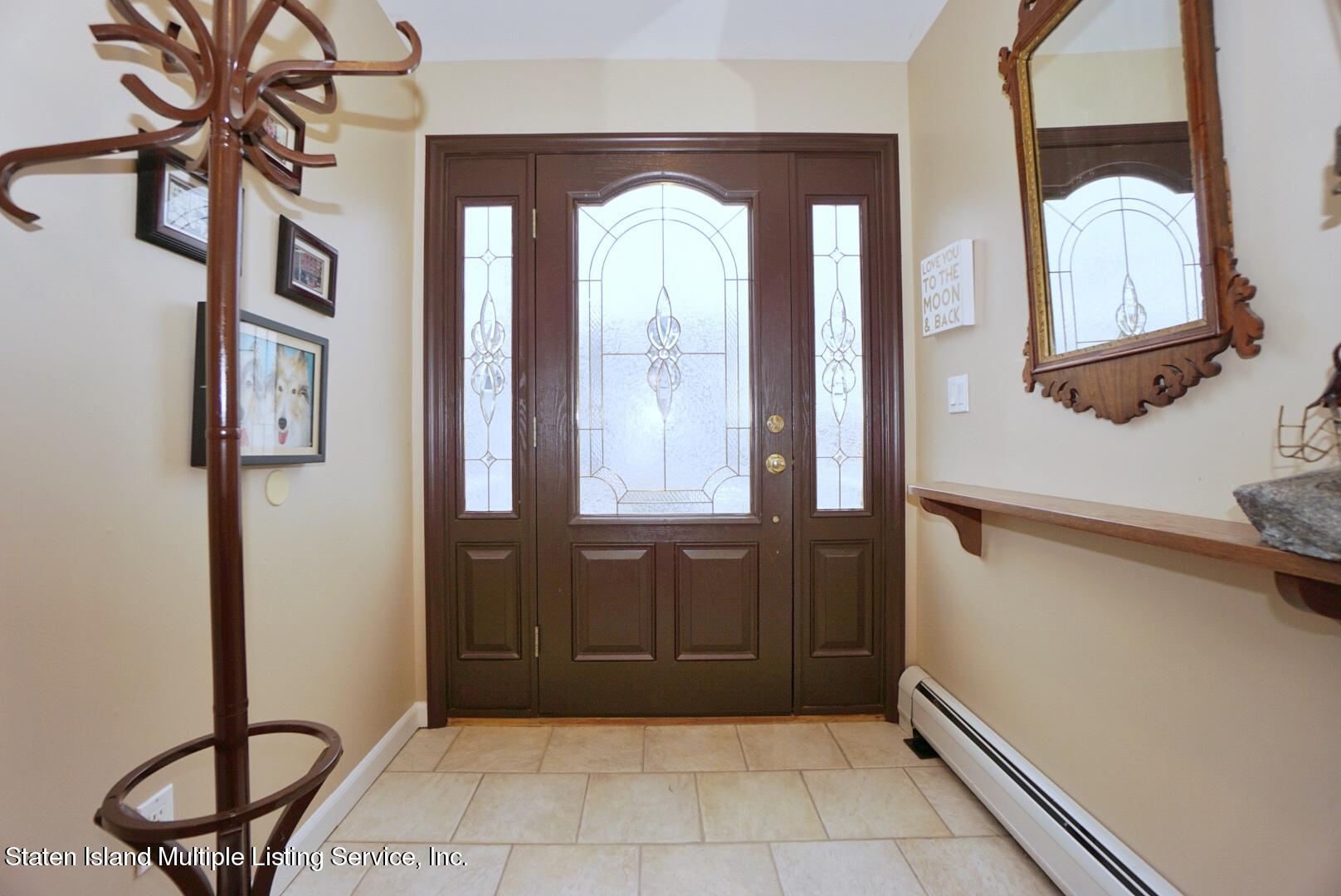 65 Lander Avenue Staten Island, NY 10314 - Photo 8 of 53 a view of a entryway door with wooden floor