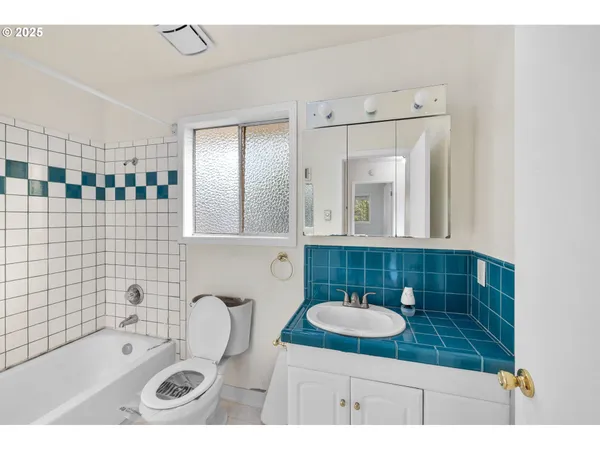a bathroom with a sink double vanity and a mirror