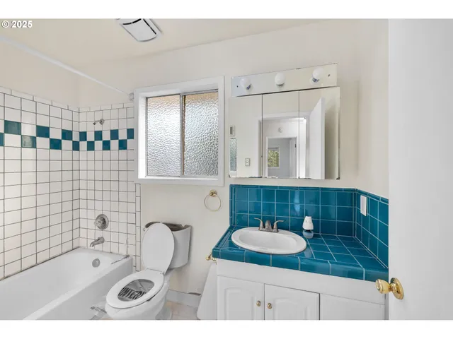 a bathroom with a sink double vanity and a mirror