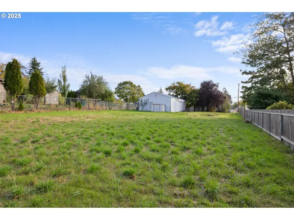 a backyard of a house with lots of green space