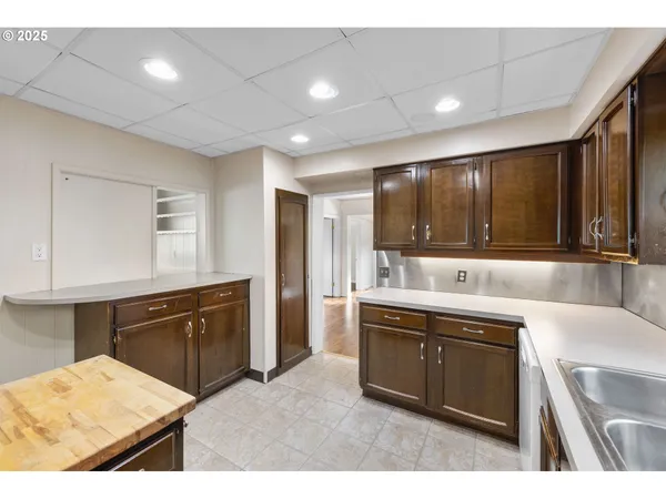 a kitchen with a sink and cabinets