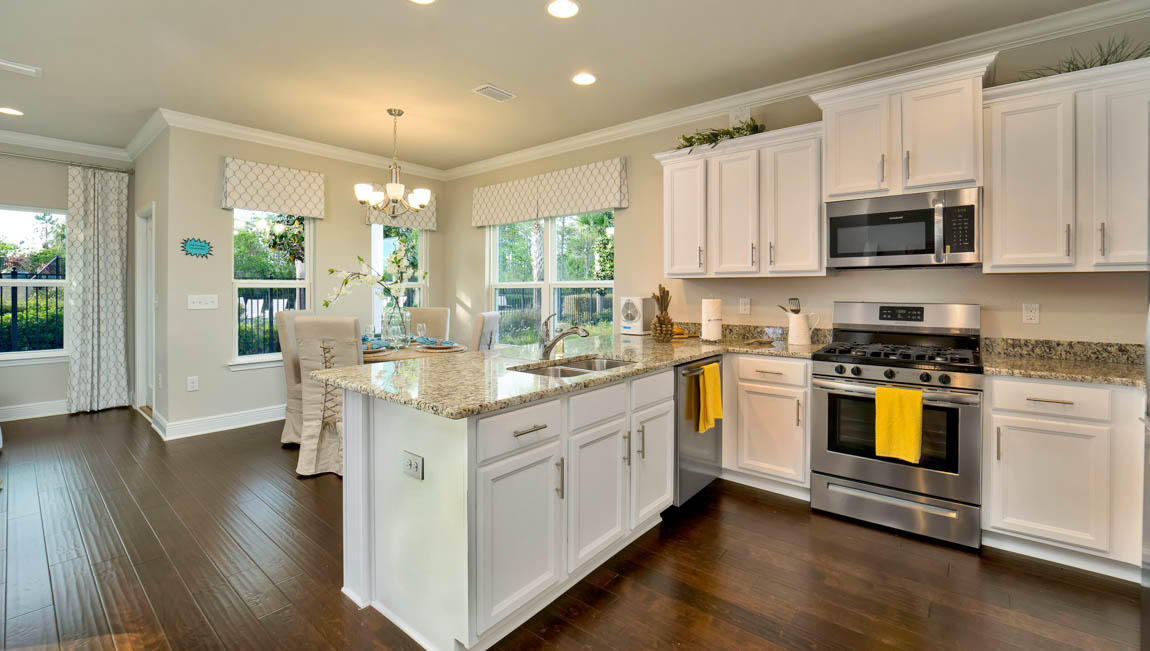 260 Southern Pnes Road, Unit LOT 26 Santa Rosa Beach, FL 32459 - Photo 6 of 15 a kitchen with stainless steel appliances granite countertop a stove a sink and a microwave