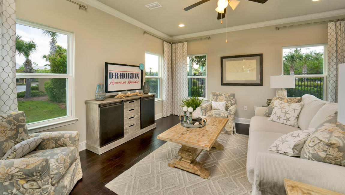 260 Southern Pnes Road, Unit LOT 26 Santa Rosa Beach, FL 32459 - Photo 8 of 15 a living room with furniture a large window and a fireplace