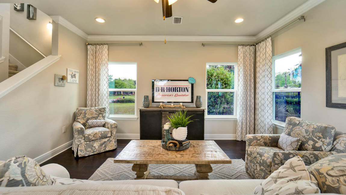 260 Southern Pnes Road, Unit LOT 26 Santa Rosa Beach, FL 32459 - Photo 9 of 15 a living room with furniture floor to ceiling window and a potted plant