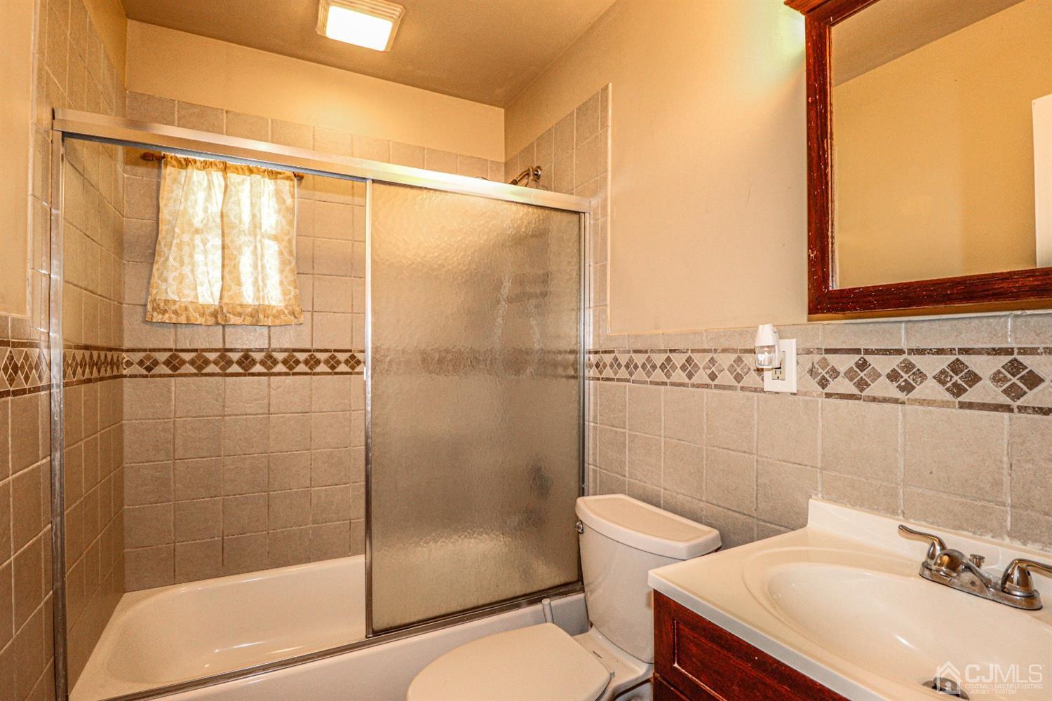 17 Dayton Road Edison, NJ 08817 - Photo 11 of 25 a bathroom with a sink toilet and shower