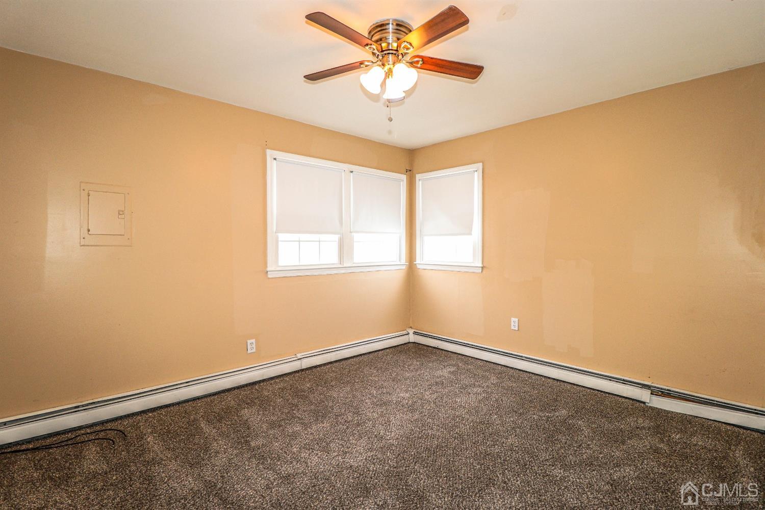 17 Dayton Road Edison, NJ 08817 - Photo 13 of 25 wooden floor in an empty room with a window