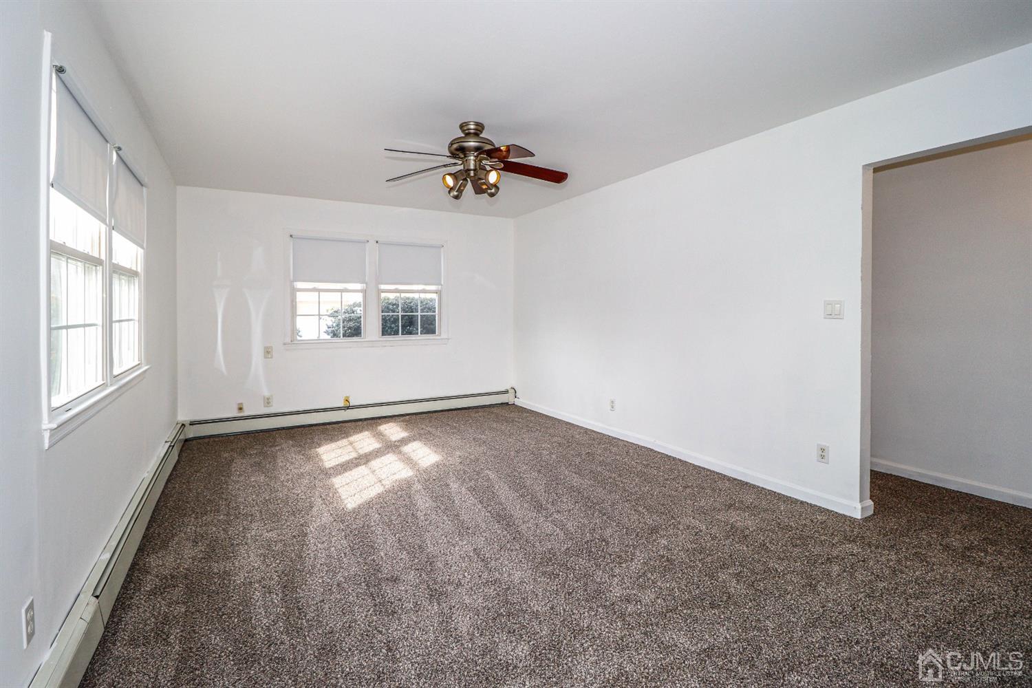 17 Dayton Road Edison, NJ 08817 - Photo 2 of 25 wooden floor in an empty room with a window