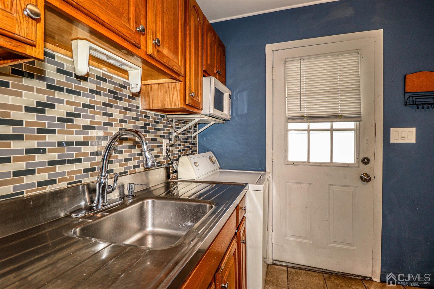 17 Dayton Road Edison, NJ 08817 - Photo 9 of 25 a bathroom with a sink and a shower