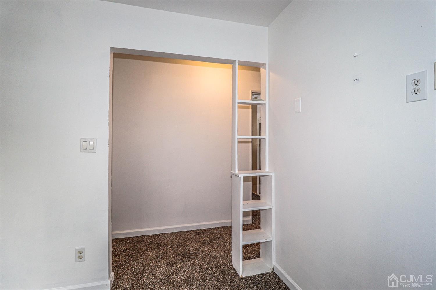 17 Dayton Road Edison, NJ 08817 - Photo 10 of 25 a view of walk in closet with empty racks
