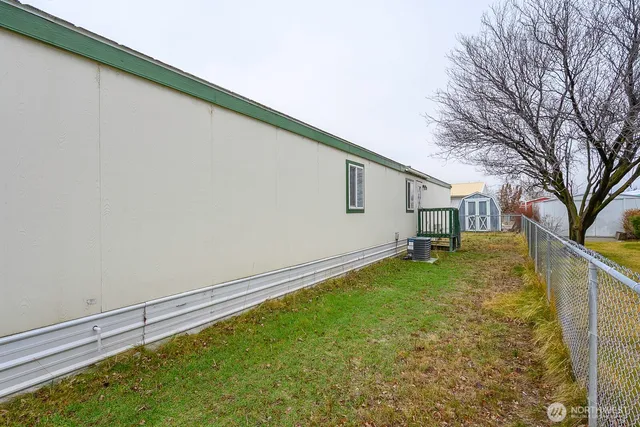 a view of a kitchen with a sink and a refrigerator