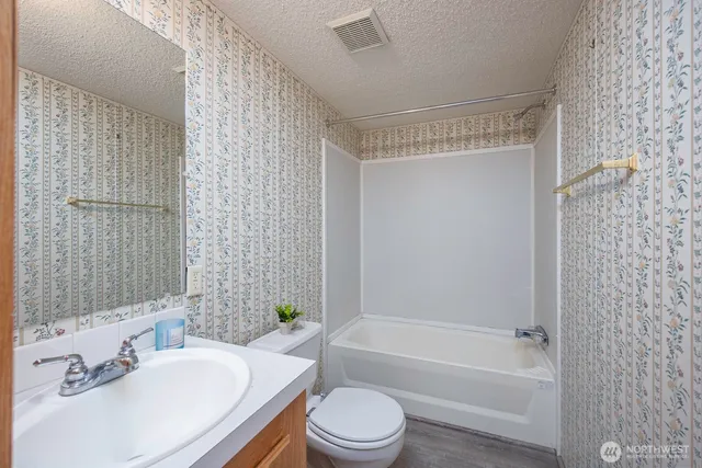 a view of an empty room and a window