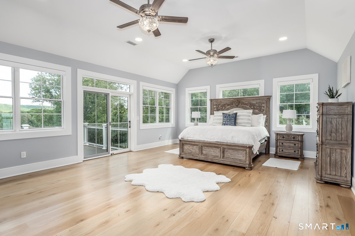 2 Pond View Lane Sherman, CT 06784 - Photo 19 of 40 a bedroom with a large bed and a large window