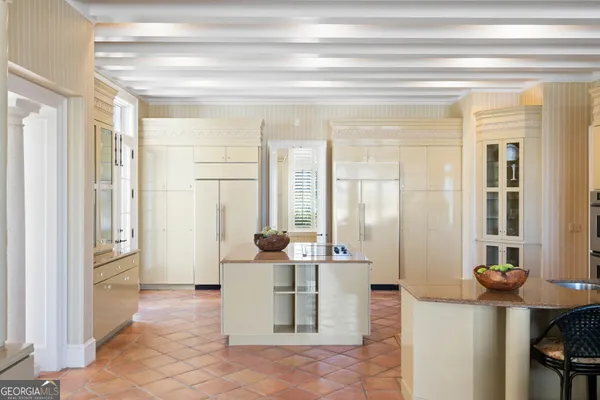 a dining room with furniture wooden floor and a chandelier