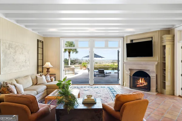 a view of a house with pool and chairs