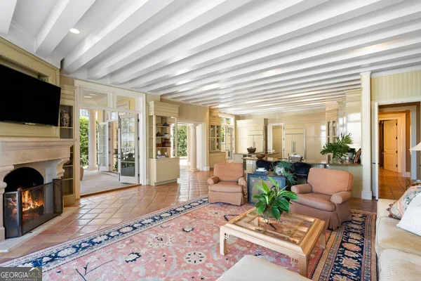 a spacious bedroom with a bed and a couch