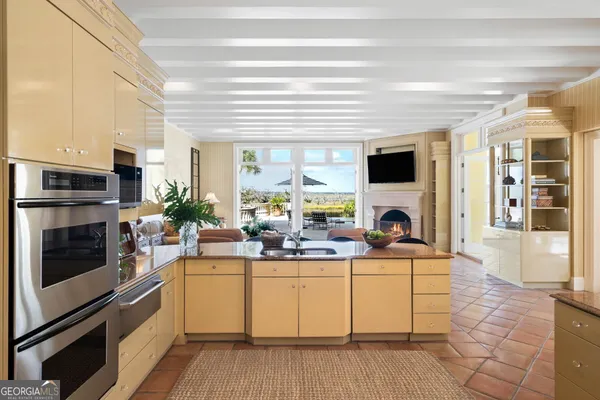 a living room with furniture and a book shelf
