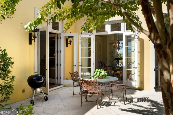 a living room with furniture a rug and a fireplace
