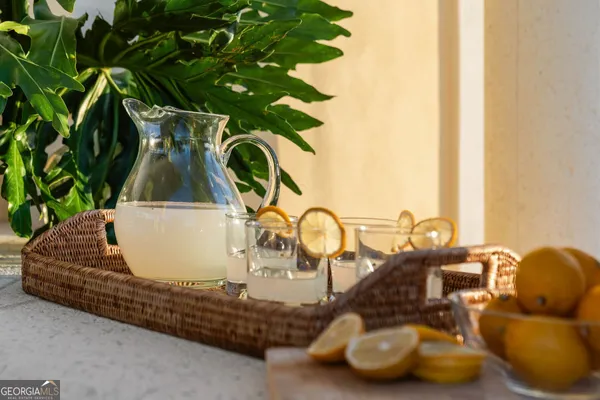 a living room with furniture a rug and a large window