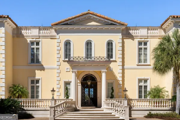 a living room with furniture fireplace and a large window