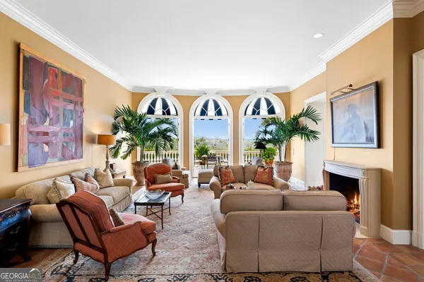 a view of dining room and livingroom with furniture wooden floor and a chandelier
