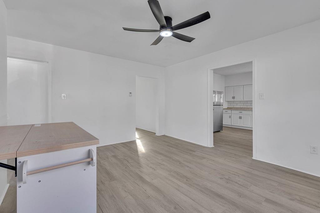 498 Blockhouse Run Road New Brighton, PA 15066 - Photo 13 of 23 a view of kitchen and empty room with wooden floor