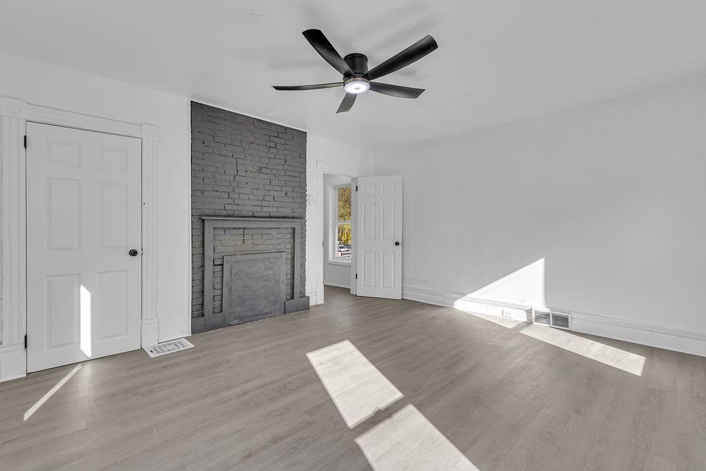 498 Blockhouse Run Road New Brighton, PA 15066 - Photo 15 of 23 wooden floor in an empty room with a window