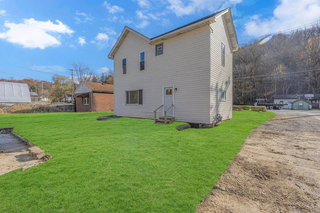 498 Blockhouse Run Road New Brighton, PA 15066 - Photo 3 of 23 a view of a backyard with plants and large trees