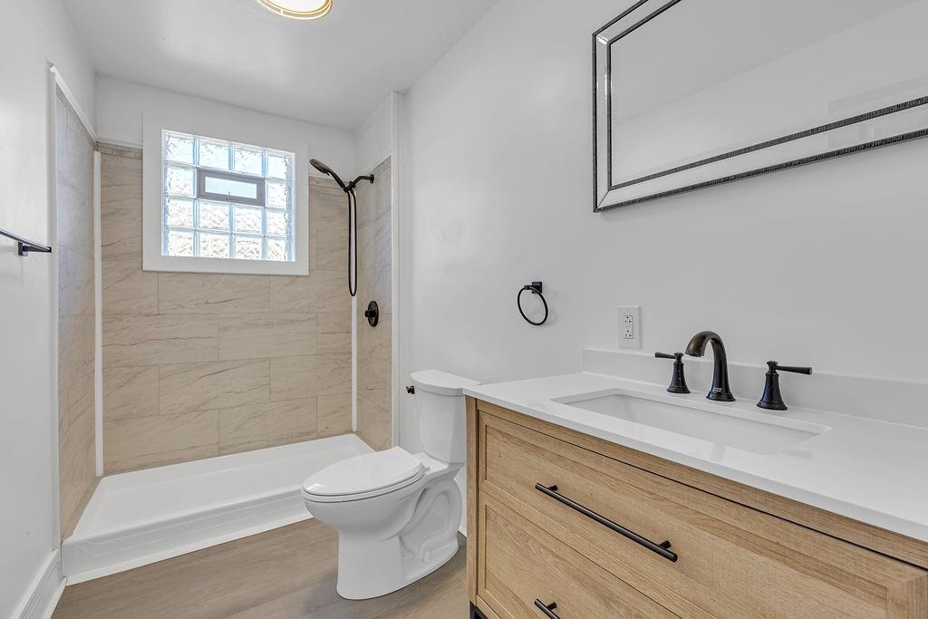 498 Blockhouse Run Road New Brighton, PA 15066 - Photo 8 of 23 a bathroom with a sink a toilet and shower