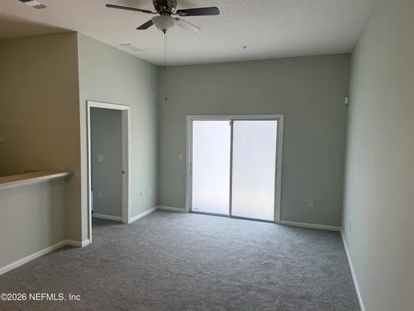 a kitchen with granite countertop cabinets and refrigerator