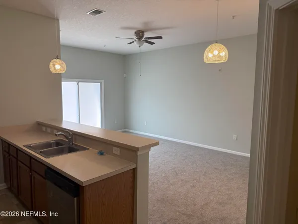 a view of an empty room with a window