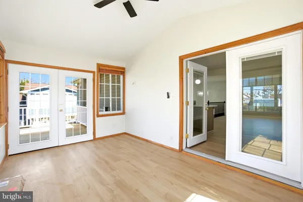 a view of an empty room with glass door