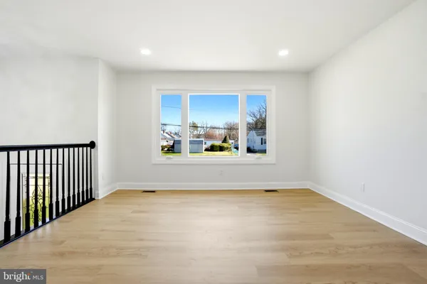a view of a room with a window and a kitchen view