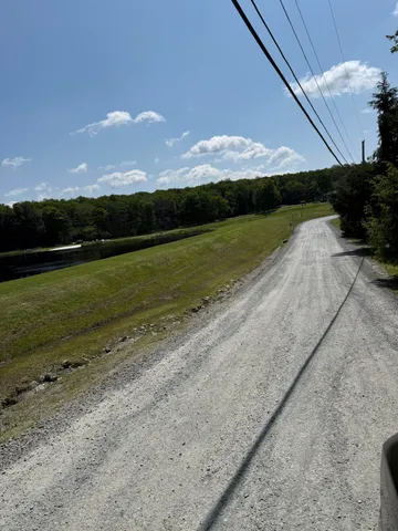 a view of a lake in front of a house