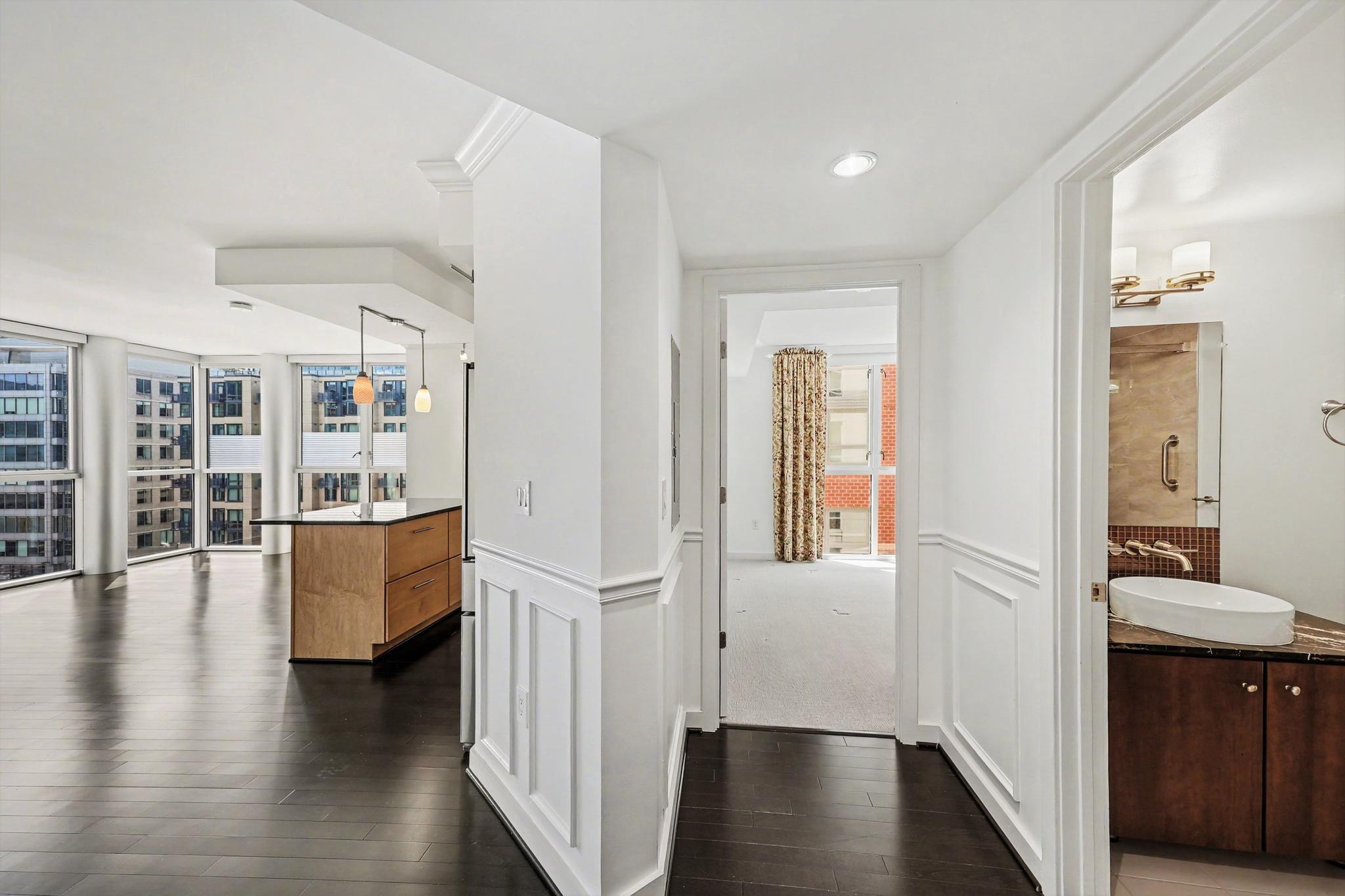 1025 First Street Southeast, Unit 906 Washington, DC 20003 - Photo 15 of 34 wooden floor with white walls and windows