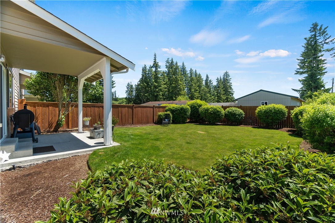 6309 199th Loop Southwest Rochester, WA 98579 - Photo 8 of 27 a view of a backyard with porch