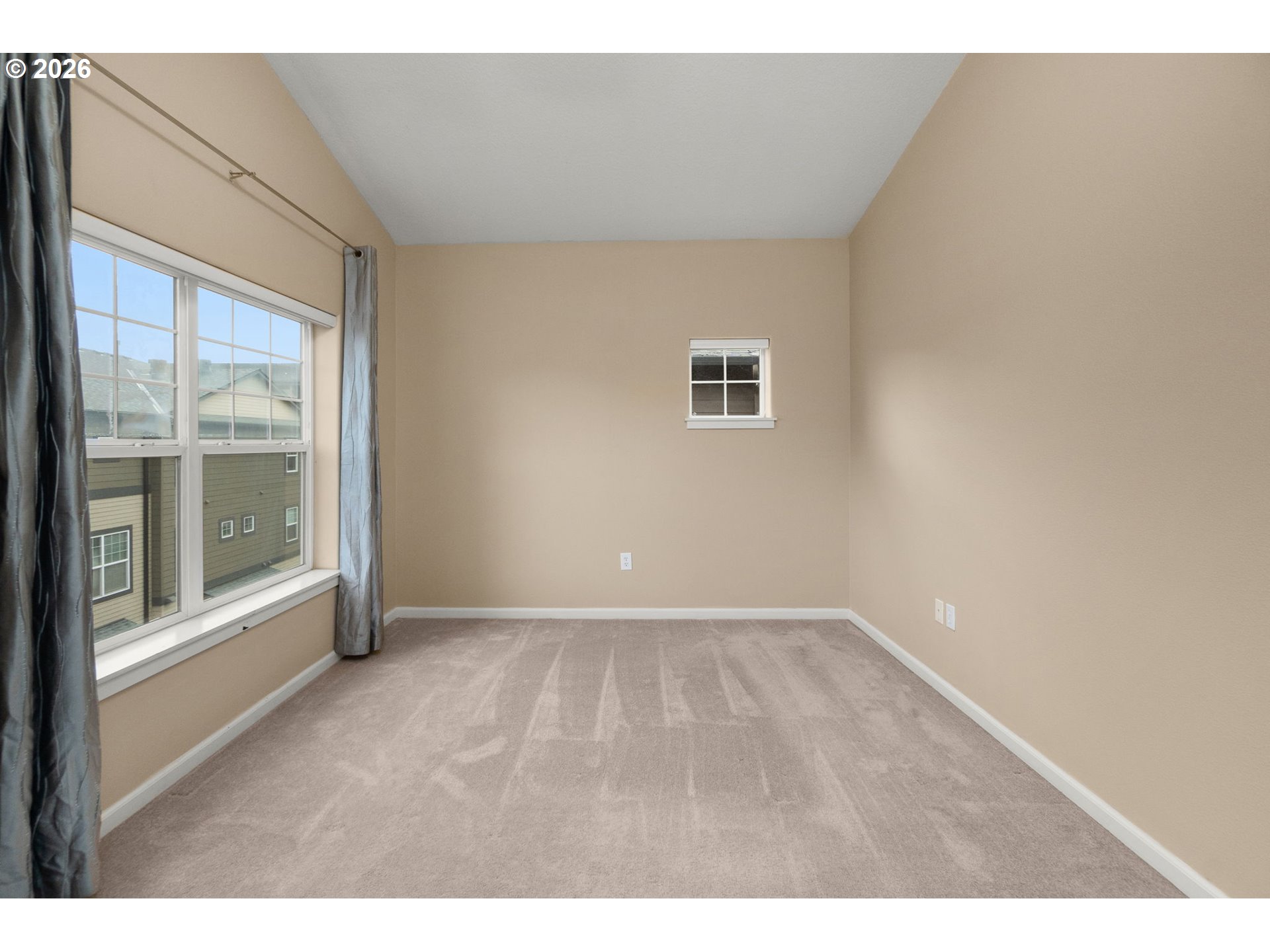 1060 Southwest 170th Avenue, Unit 202 Beaverton, OR 97003 - Photo 18 of 27 a view of an empty room with a window