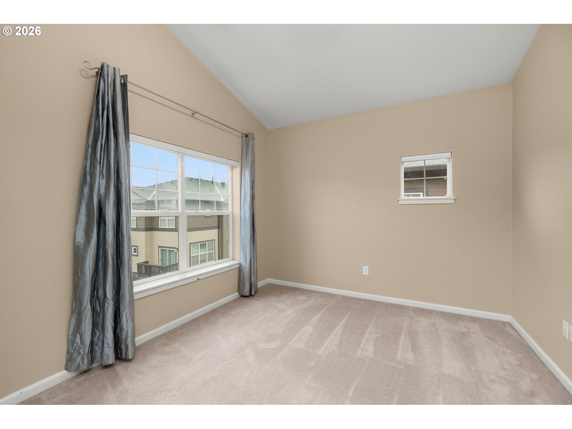 1060 Southwest 170th Avenue, Unit 202 Beaverton, OR 97003 - Photo 19 of 27 a view of an empty room with a window