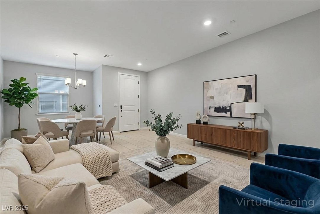 143 Aqua Commons Lane Henderson, NV 89015 - Photo 5 of 20 Living room featuring a chandelier, recessed lighting, and tile patterned floors