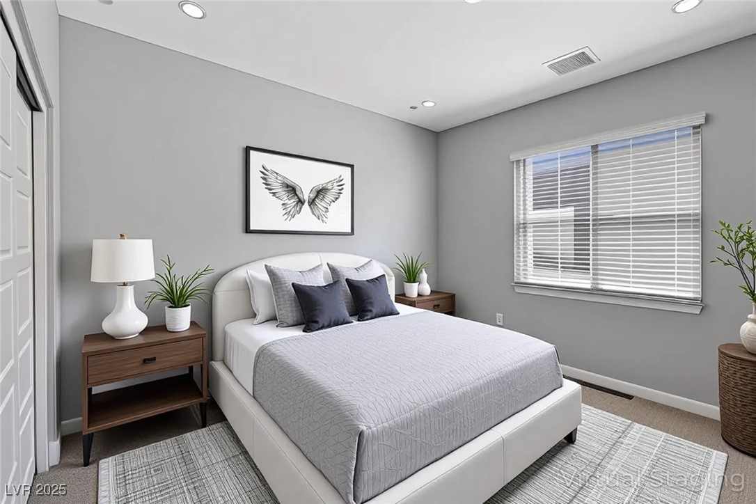 143 Aqua Commons Lane Henderson, NV 89015 - Photo 10 of 20 Bedroom with light carpet, recessed lighting, and a closet