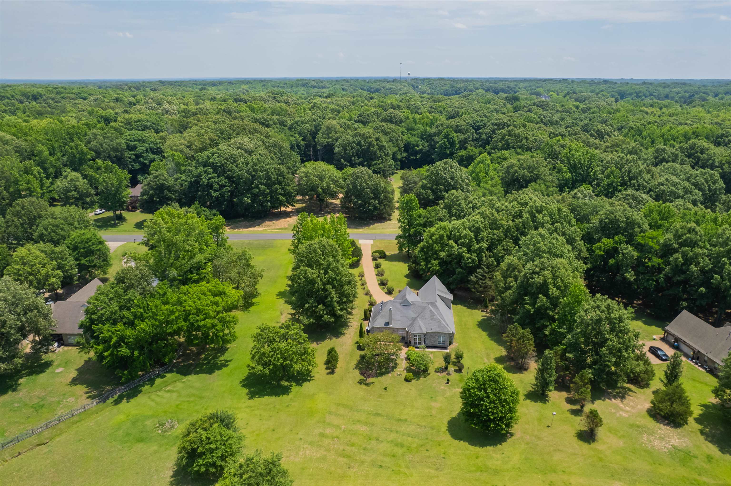 5035 Brian Ridge Road Arlington, TN 38002 - Photo 37 of 40 Expansive estate featuring a large main residence, a secondary building, and mature trees