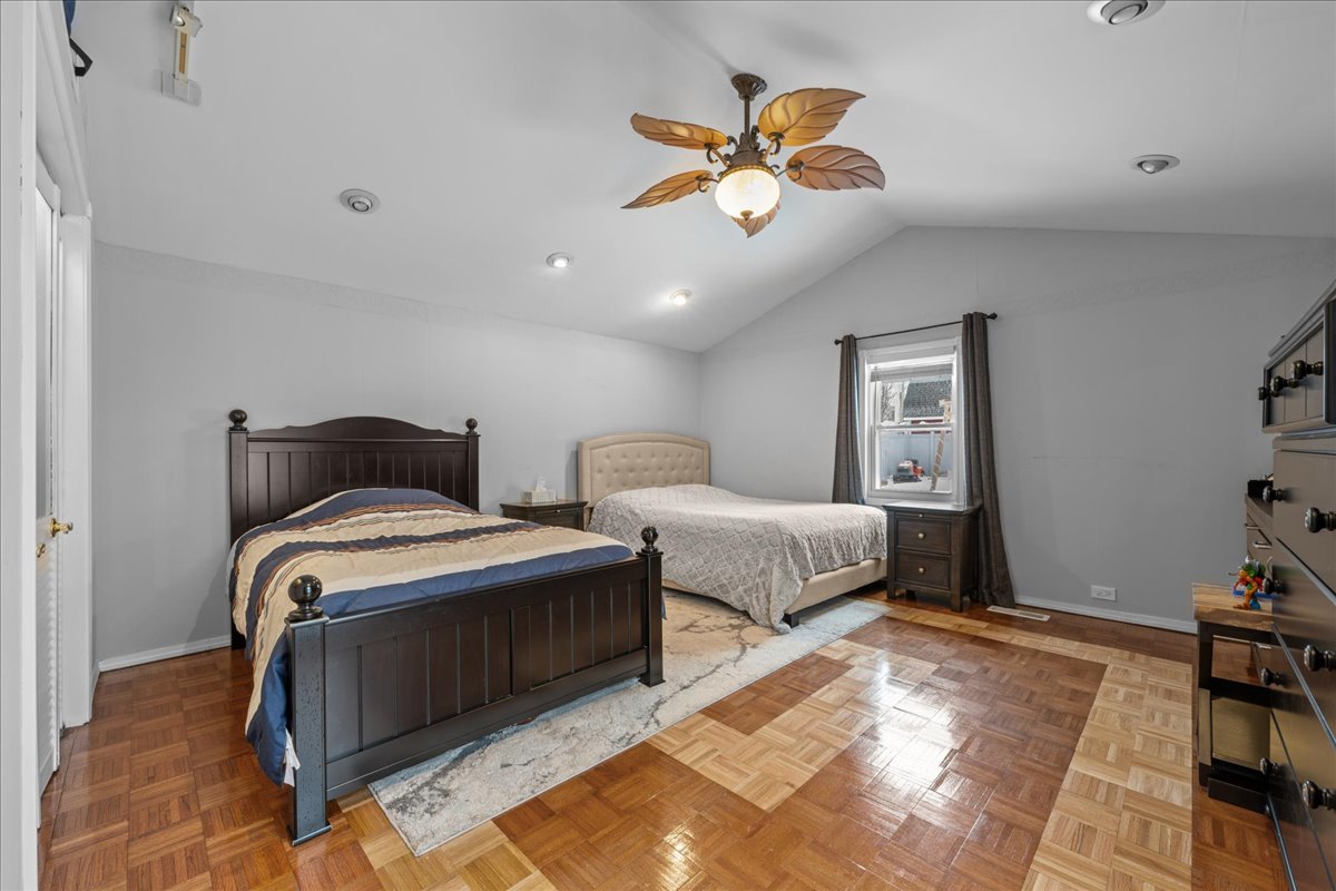 207 Second Street Elgin, IL 60123 - Photo 11 of 16 a bedroom with bed and a chandelier