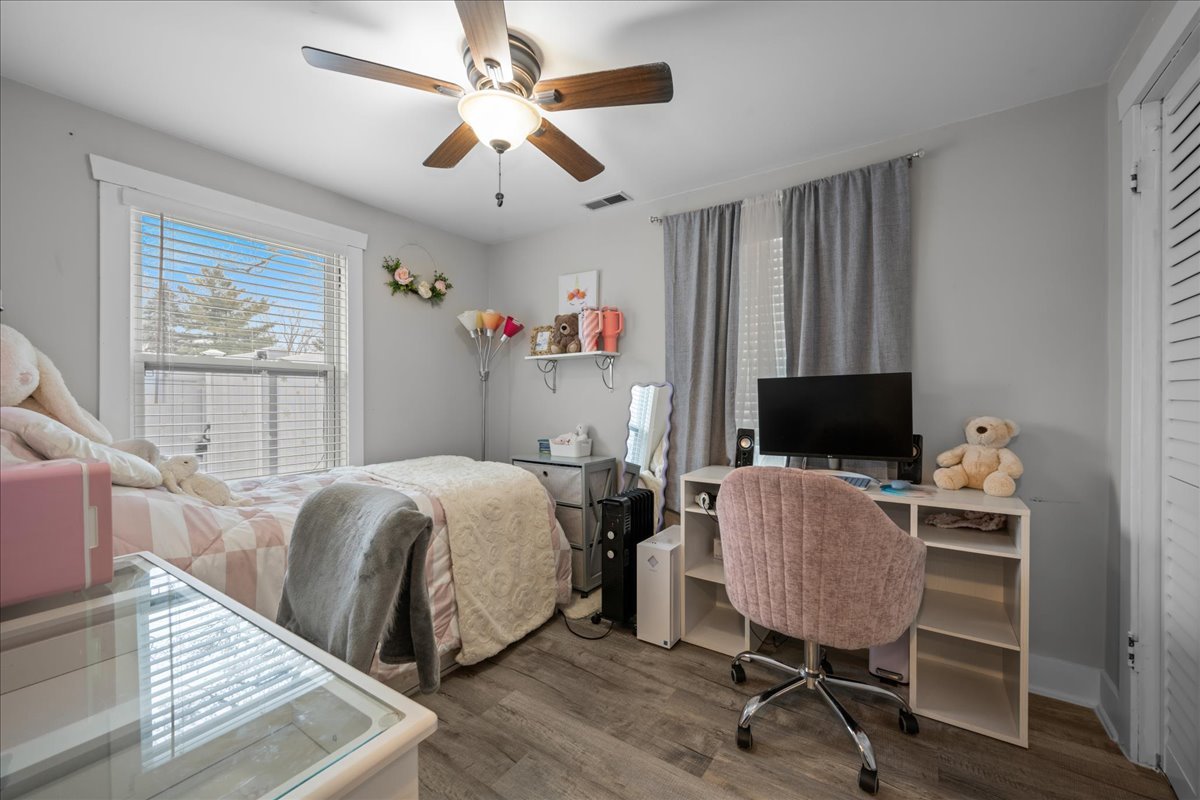 207 Second Street Elgin, IL 60123 - Photo 12 of 16 a bedroom with a bed and a flat screen tv