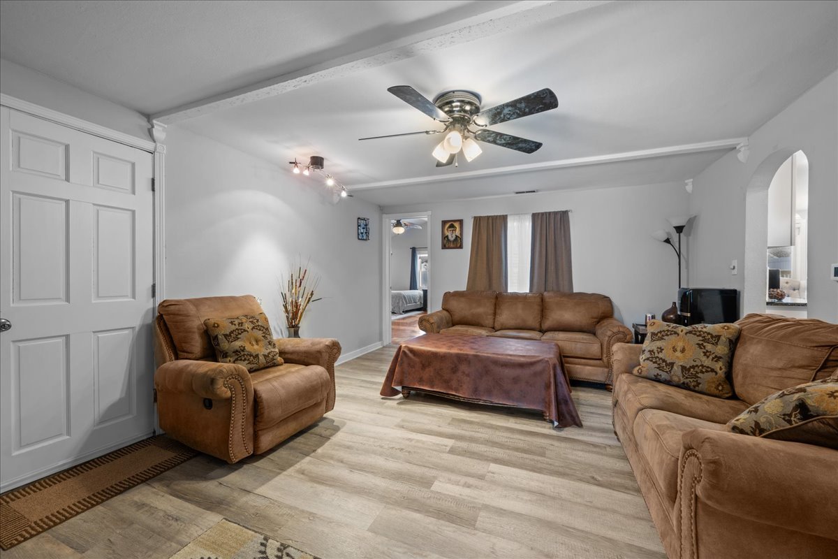 207 Second Street Elgin, IL 60123 - Photo 5 of 16 a living room with furniture and a chandelier