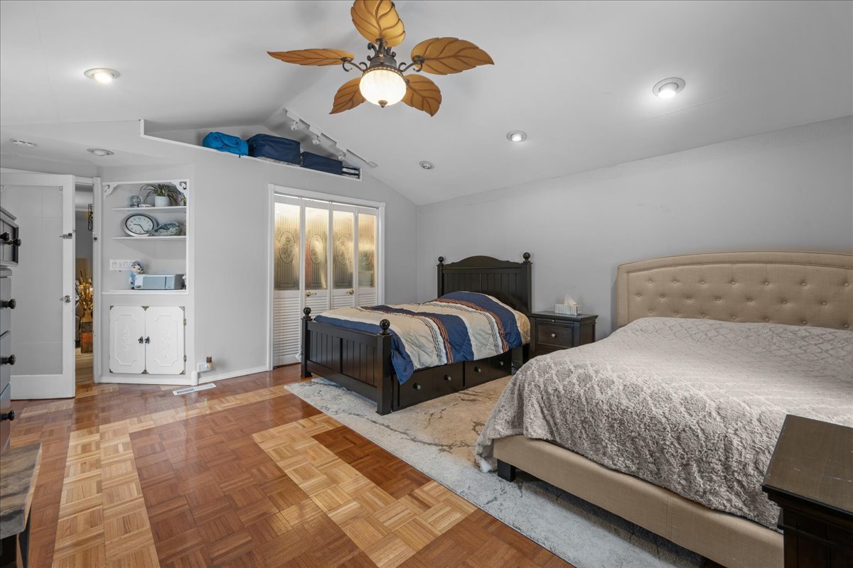 207 Second Street Elgin, IL 60123 - Photo 9 of 16 a bedroom with two beds and a chandelier