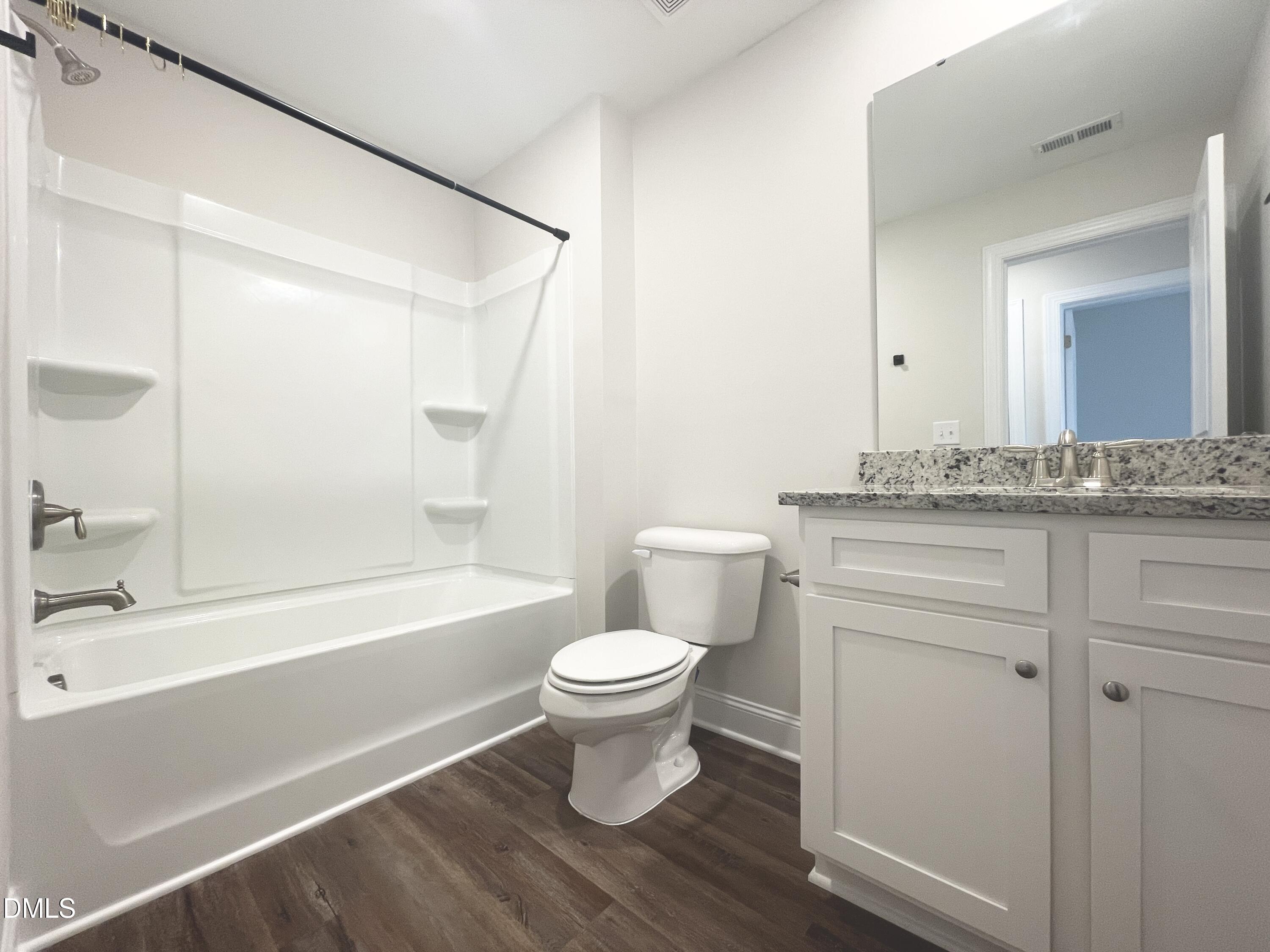 6945 Outfall Point Lane Raleigh, NC 27616 - Photo 19 of 23 a bathroom with a sink and a toilet